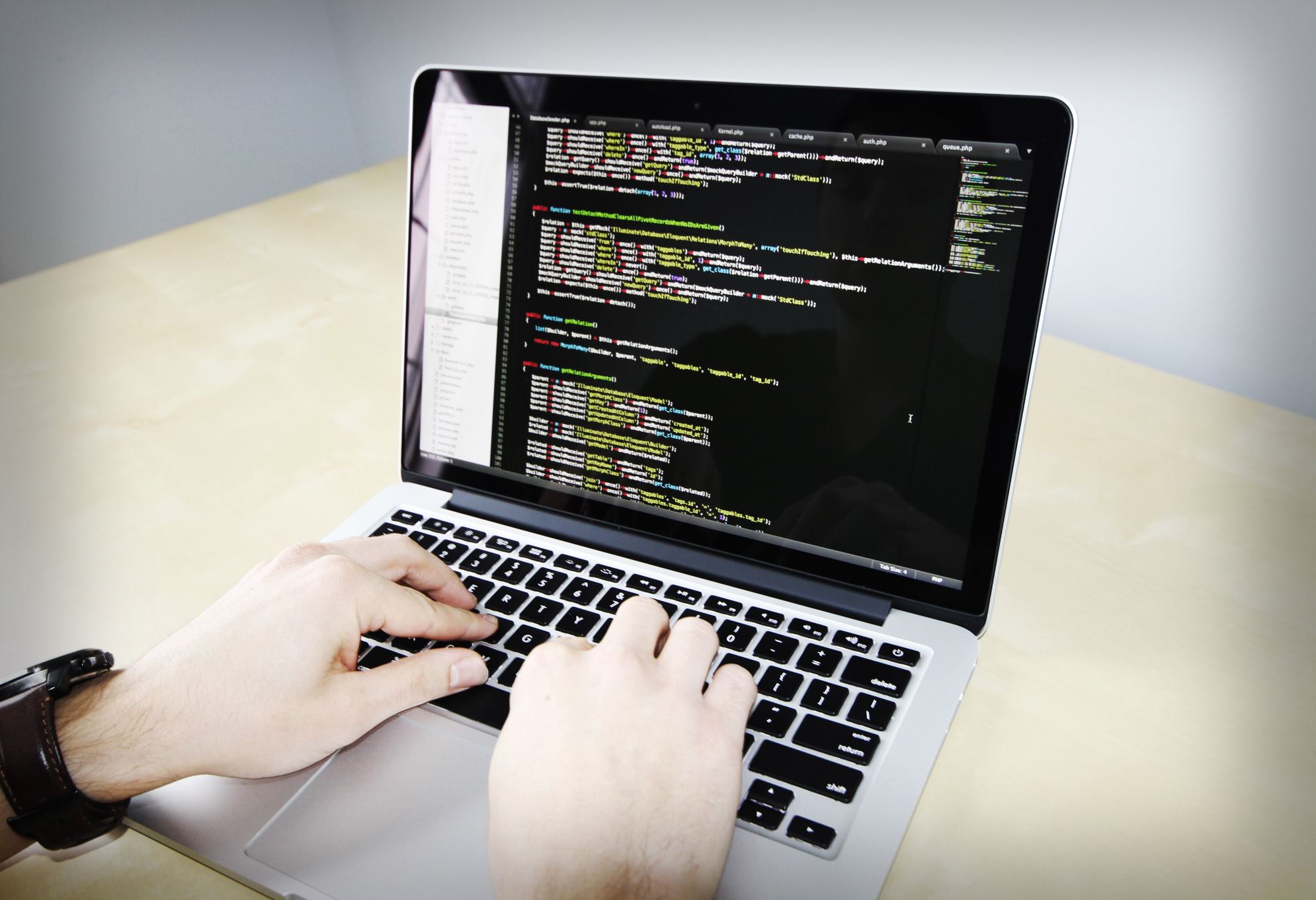 laptop with codes on the screen