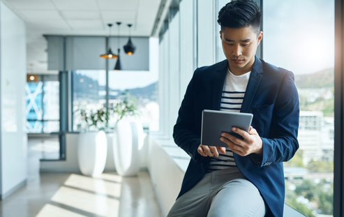 person working on a tablet at home