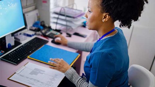 a nurse on a laptop