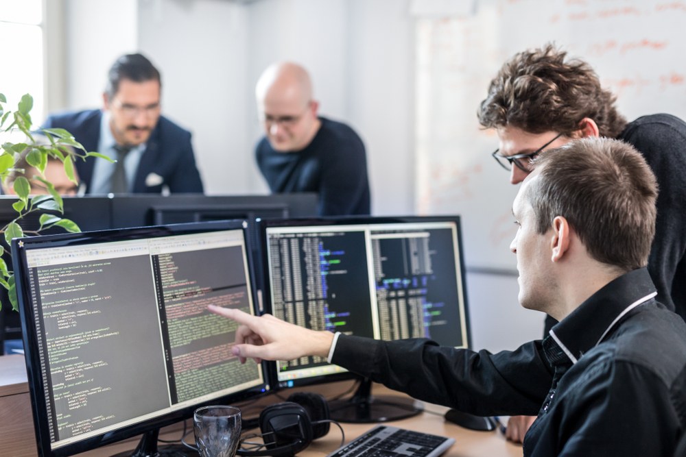people in looking at computer