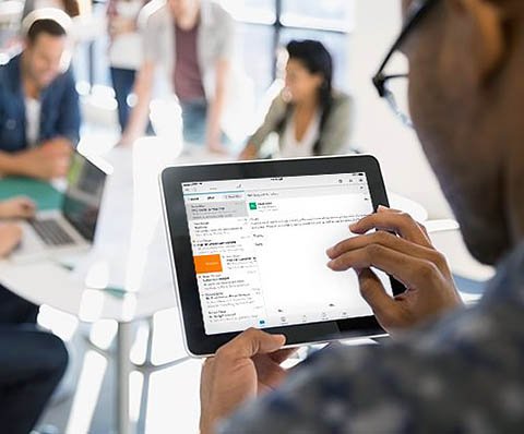 person checking their email on the tablet