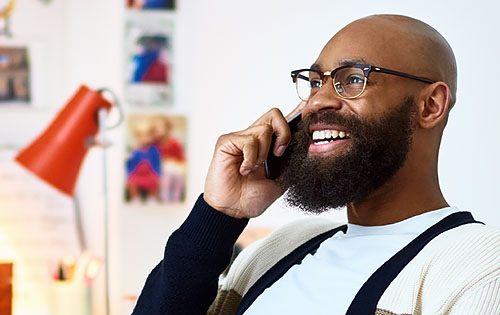 person talking on the phone and smiling
