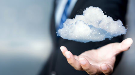 a man in a suit holding a cloud