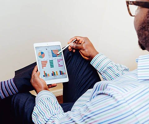 man working on his tablet