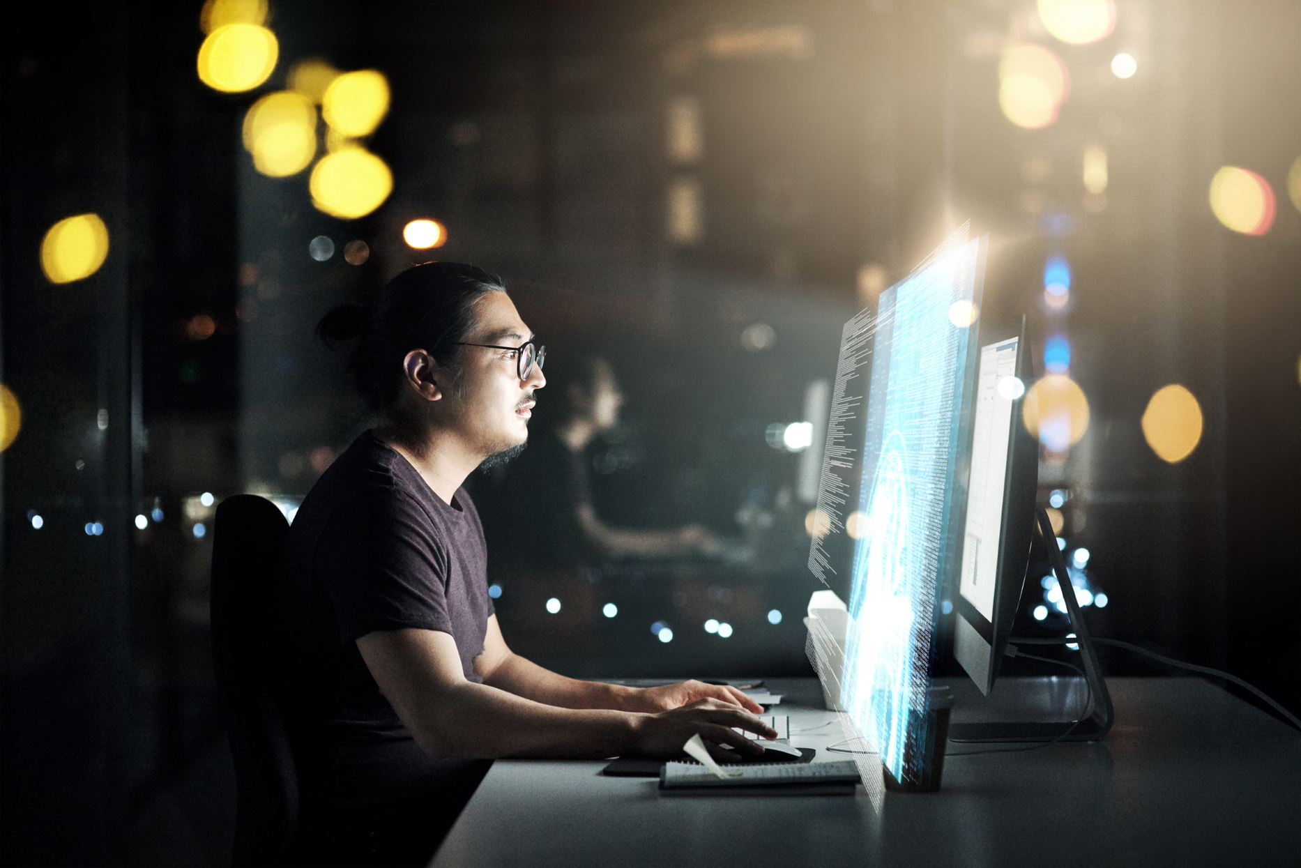 person working on the computer at night