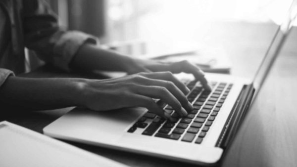 Woman typing in her computer