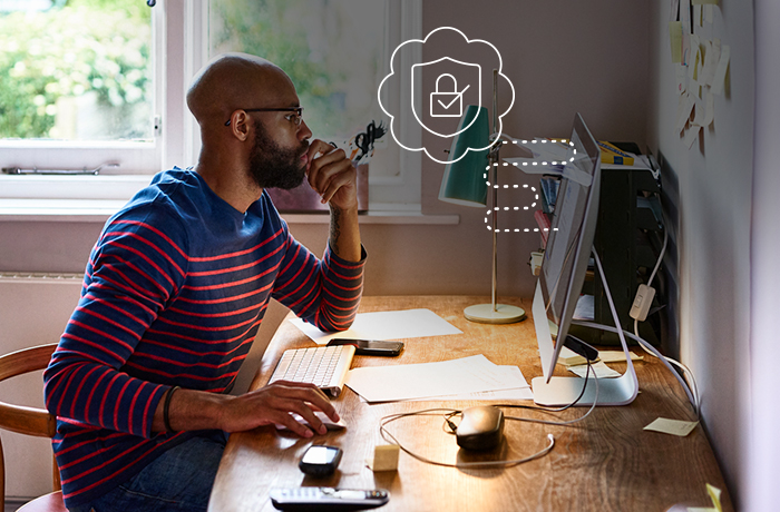 man looking at computer and using mouse