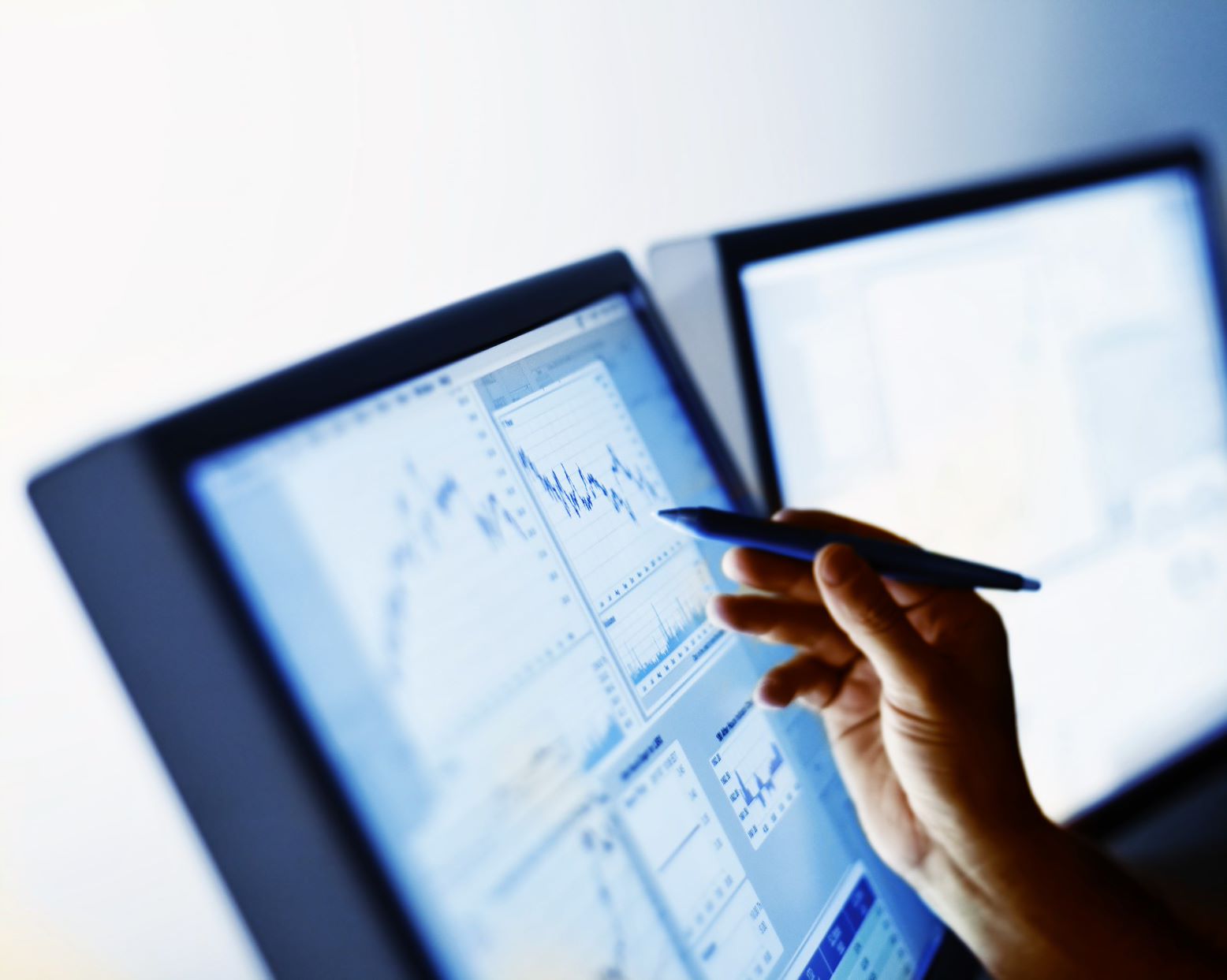 person working on the graphs with a pen