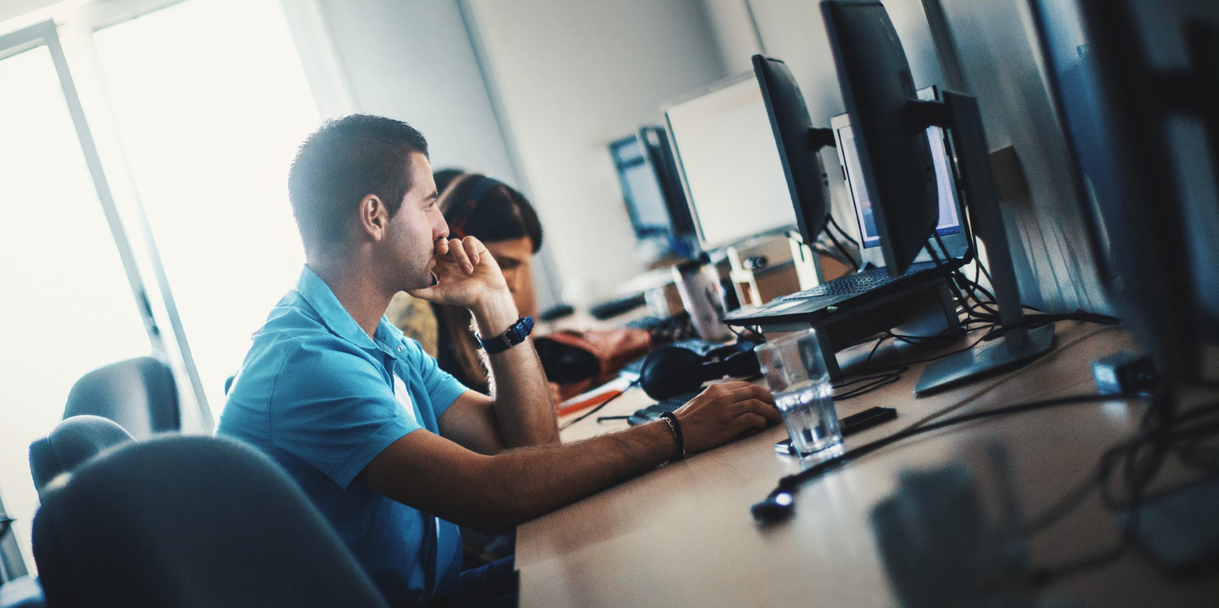 two people working on the computer