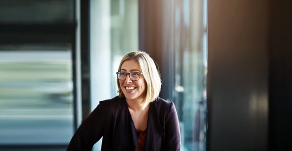 woman with glasses smiling