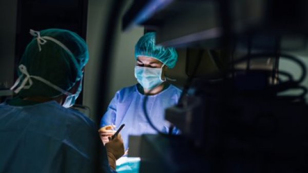 surgeons performing a surgery