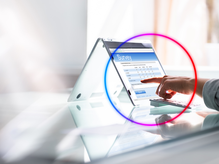 A circled finger pointing at a survey on a tablet screen