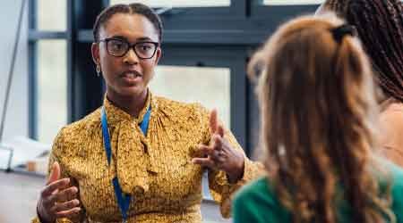 Woman explaining something to another woman